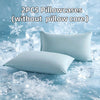 Two white pillowcases without a core resting on ice and snow.