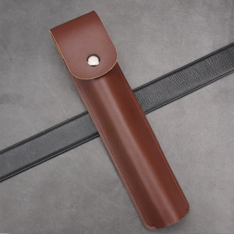 A brown leather holster for a manual wood auger drill, shown diagonally on a gray surface.