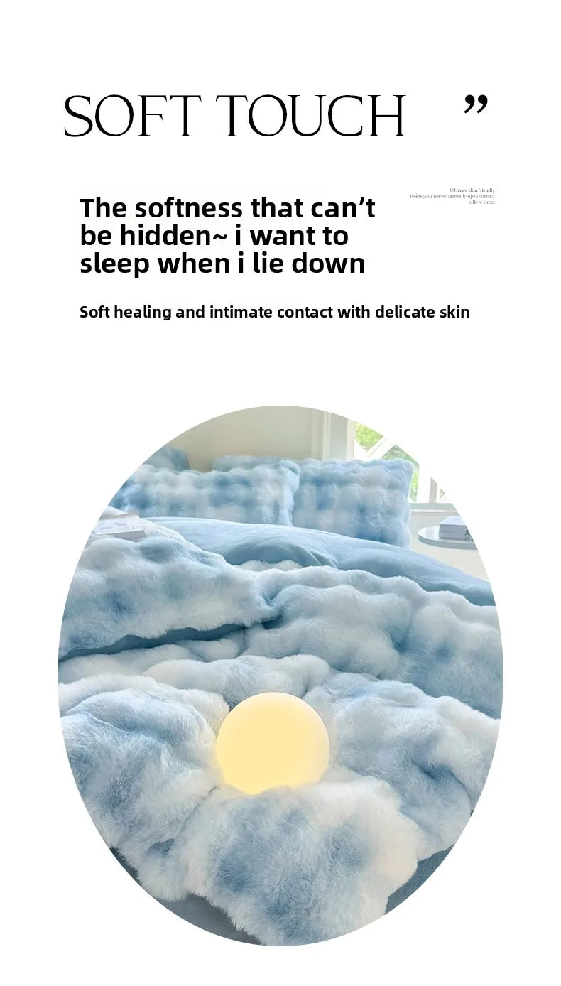 A close-up of a light blue plush fleece duvet cover with a rabbit design, featuring a glowing orb.