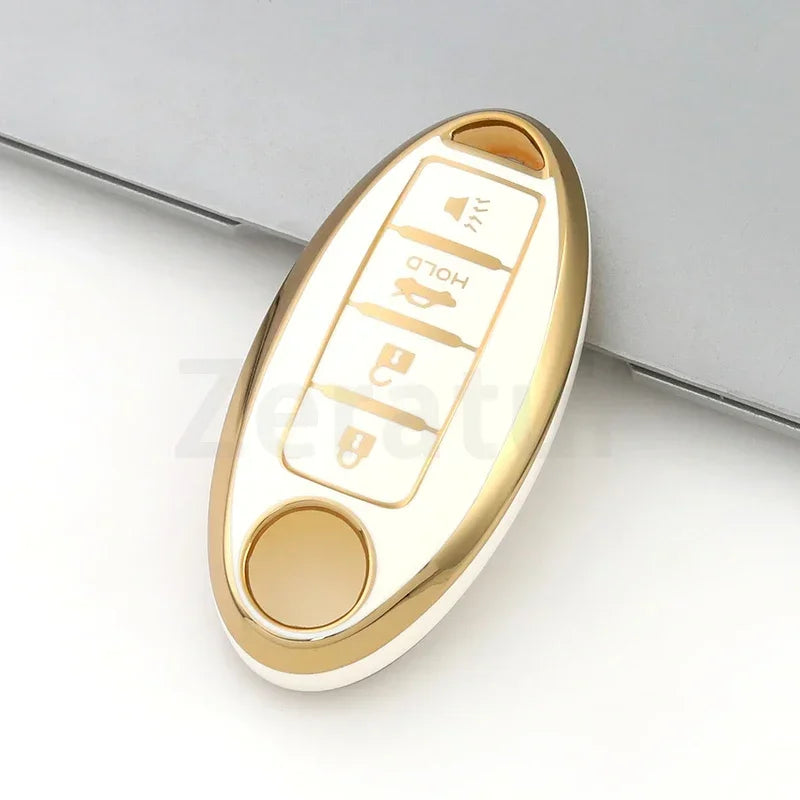 A gold-colored TPU car key case cover with a sliding mechanism and various buttons for Nissan and Infiniti models.