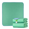 A stack of teal reusable waterproof underpads for bed protection.