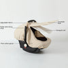 A beige breathable 2-in-1 car seat cover and mosquito net for babies with adjustable velcro and roller blind fixing strap.