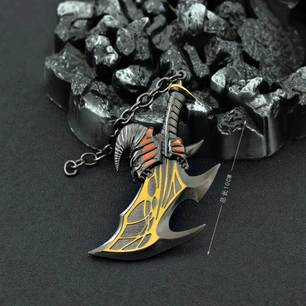 A detailed metal sword keychain featuring an axe blade and a dragon head, hanging from a chain against a dark background.