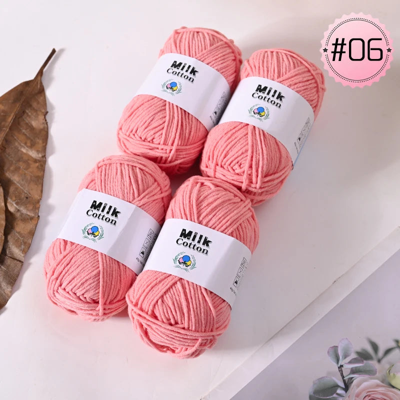 Pink Milk Cotton yarn skeins in various shades and a pink label marked #06