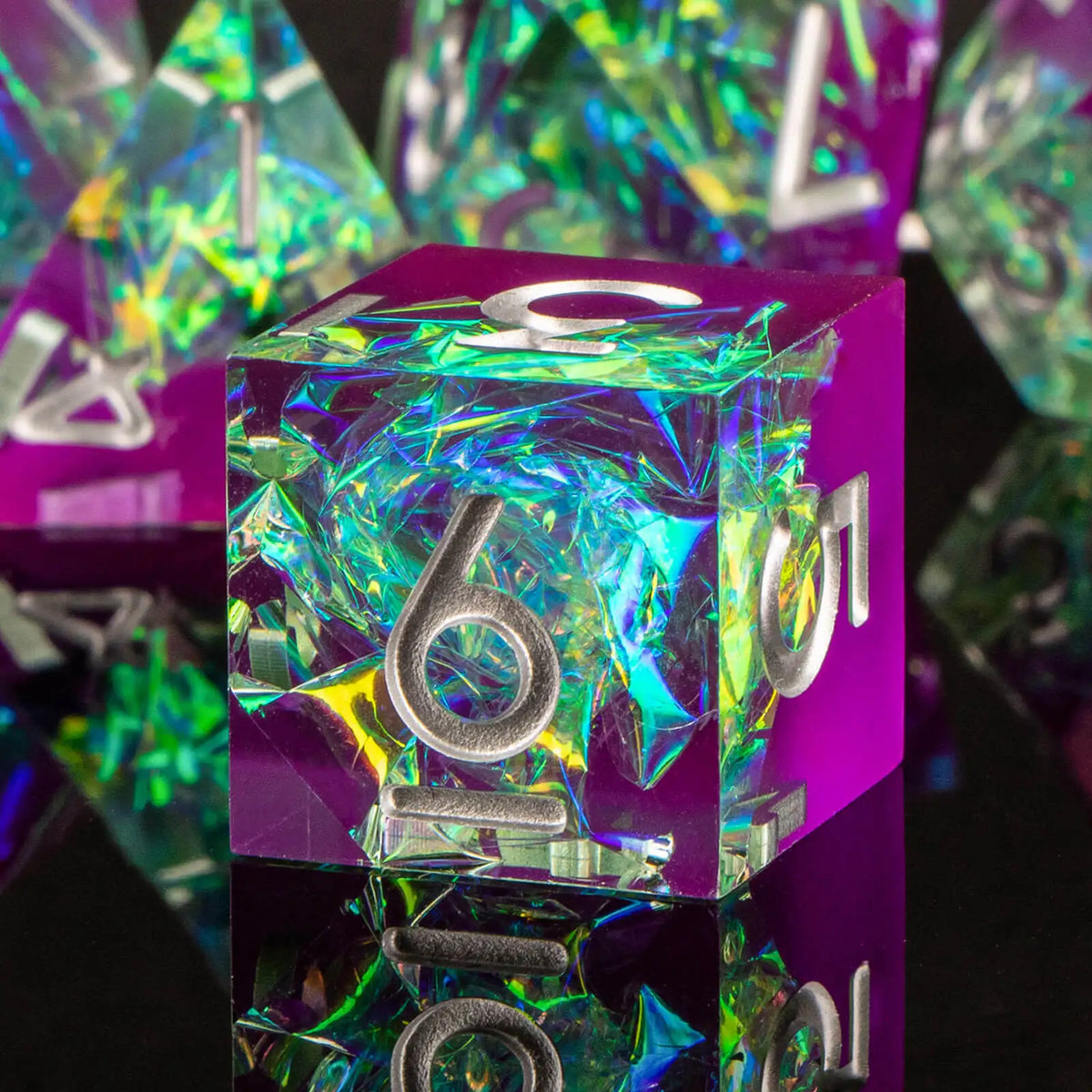 A close-up of a purple polyhedral dice set with iridescent green and blue resin, reflecting light on a dark surface.