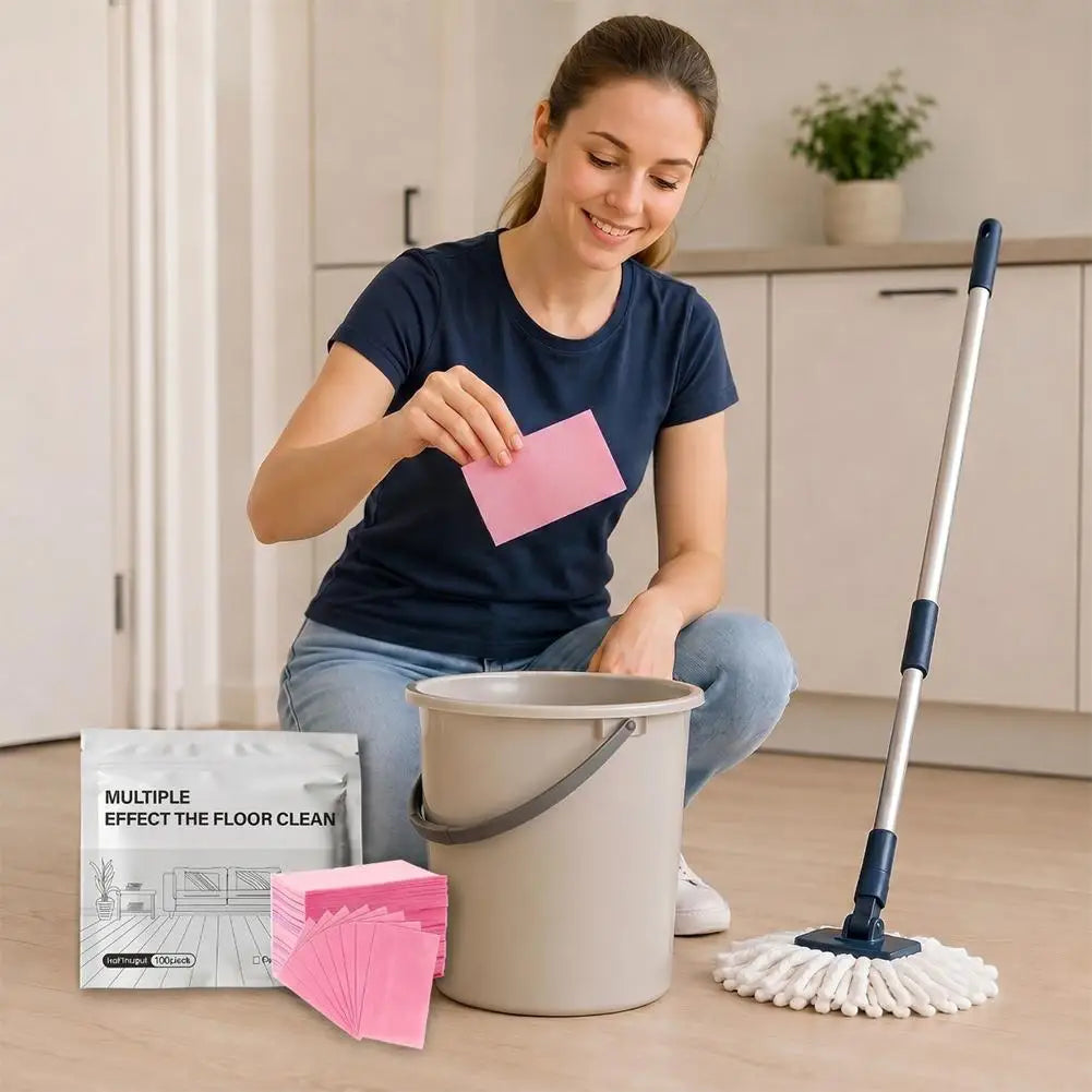 A woman is preparing to use concentrated floor cleaning tablets in a bucket and mop on a wooden floor.