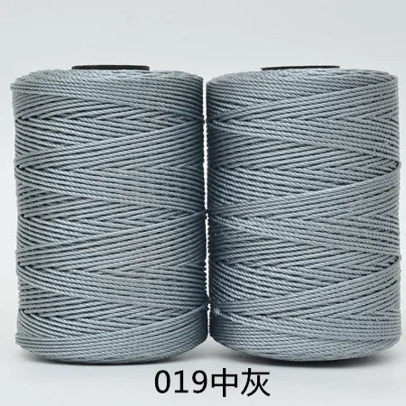 Two spools of gray 3-ply polyester knitting yarn for crochet and hand crafts