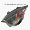 A mesh hanging toiletry bag with a top zipper design and various colored items inside.