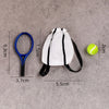 A white fabric bag with black stripes and a black strap is shown next to a blue hoop and a yellow tennis ball.