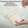 A hand is holding a transparent invisible fixing strip used to secure bed sheets, demonstrating its beautiful use.