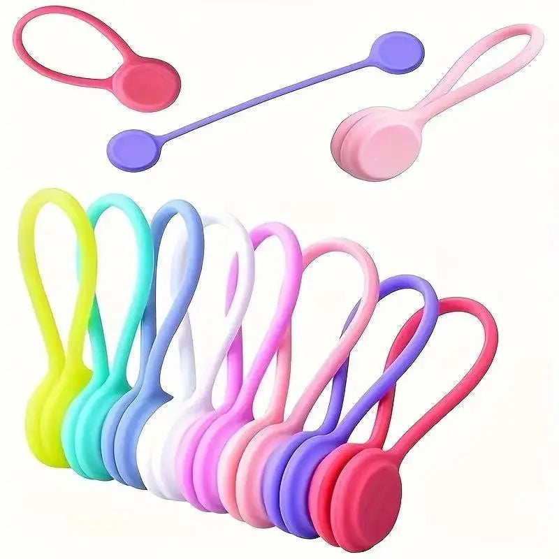 A set of three colorful magnetic silicone cable ties or cord organizers in various shades of pink, purple, and green.