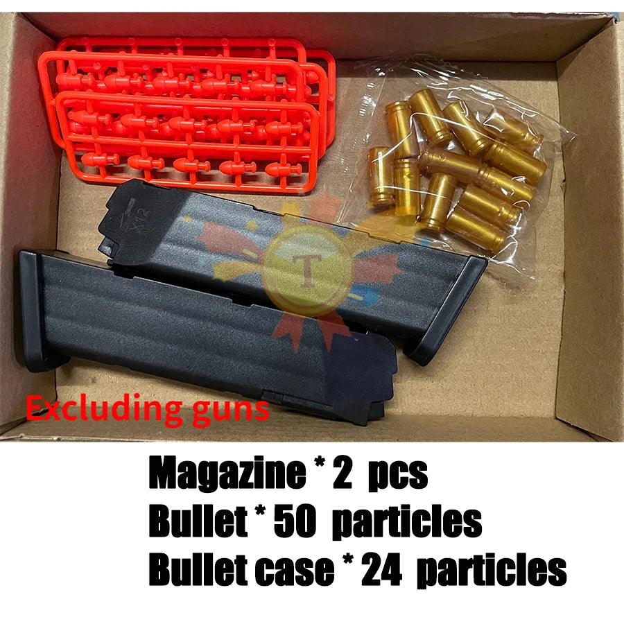 A box containing a black pistol toy, an orange pellet magazine, and a gold bullet case.