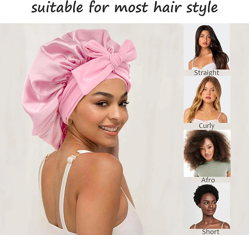 Pink satin sleeping bonnet with an adjustable tie shown on a woman's head