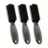 A set of three black grooming brushes for beard and hair care