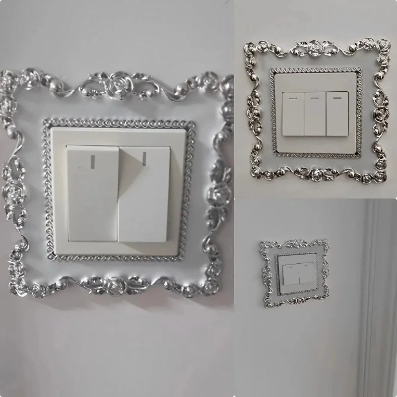A decorative silver frame surrounds a white switch cover plate with two light switches.