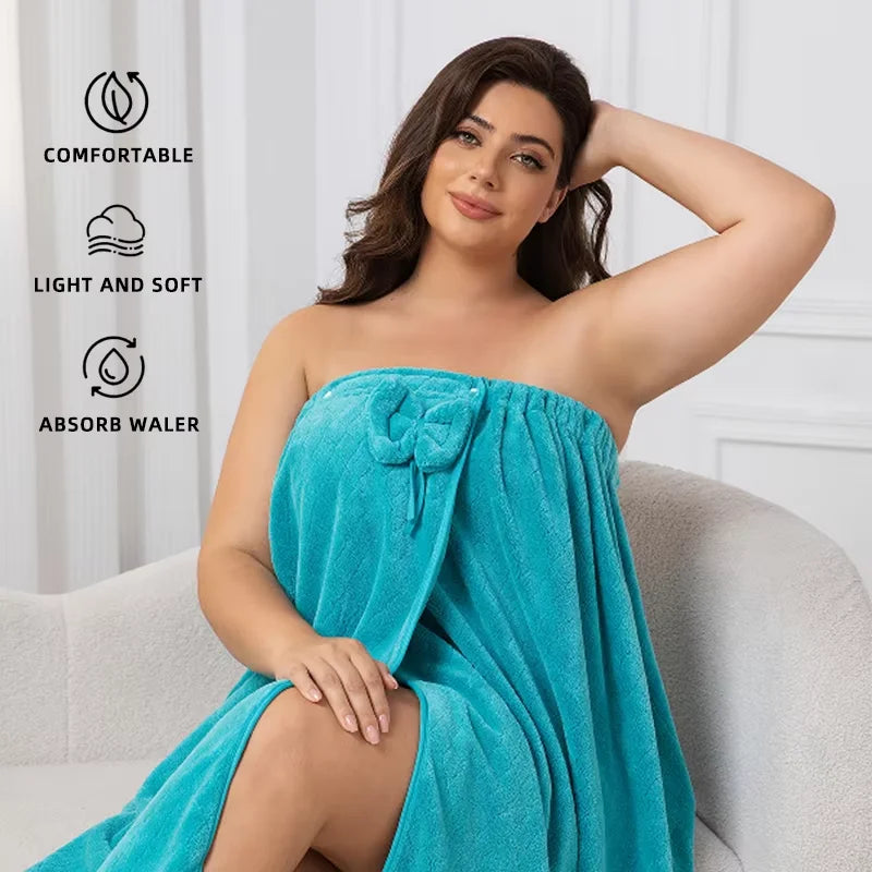A plus size woman models a teal wrap robe with a bow accent, highlighting its comfortable and absorbent features.