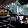 Interior view of a car showing a graffiti pattern velvet wrap sticker on the door and a steering wheel with a teddy bear keyc