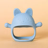 A light blue silicone cat-shaped teether for baby gums with textured ears and whiskers.