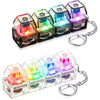 A set of colorful LED macaron keyboard fidget toys packaged as a keychain with various light patterns.