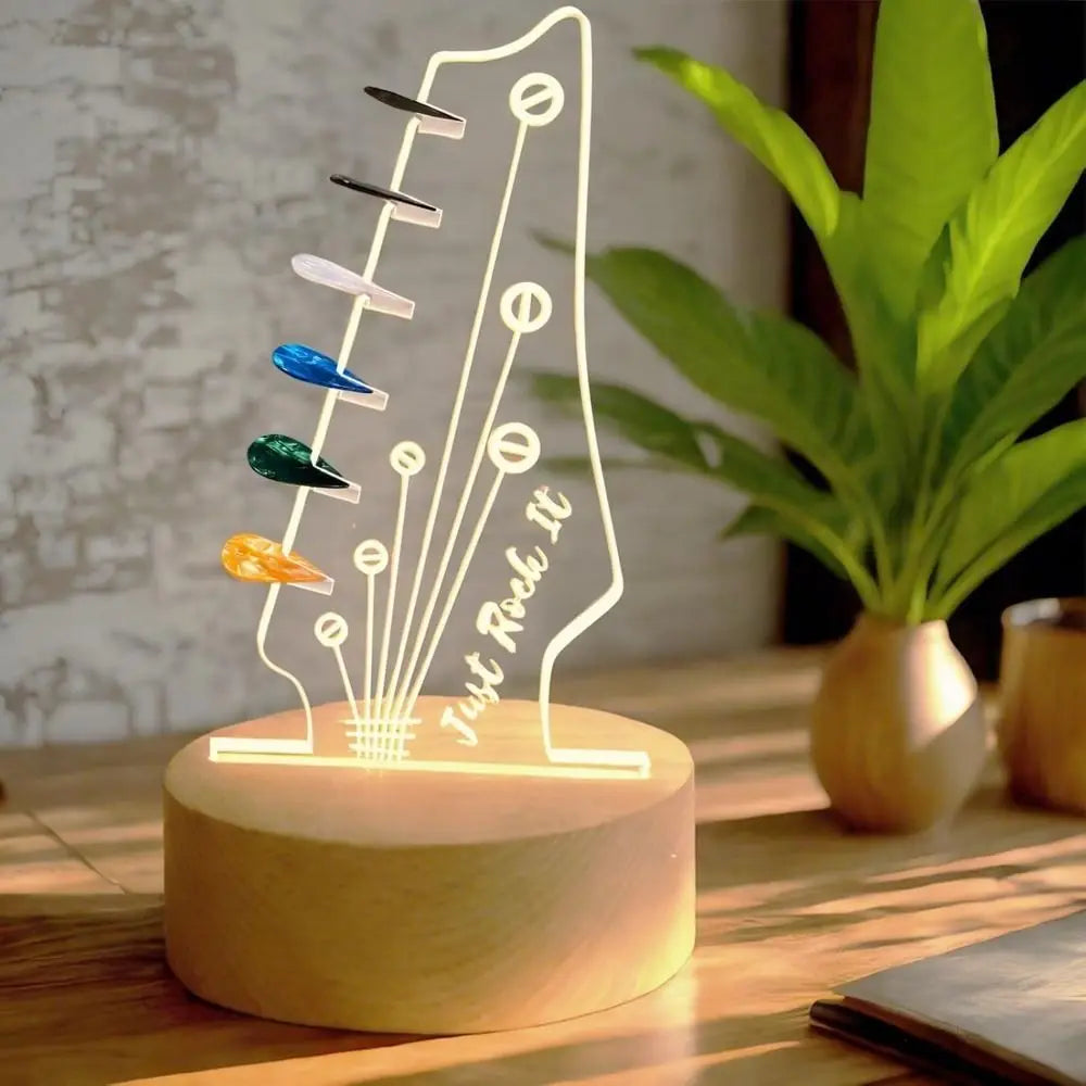 Illuminated acrylic guitar pick holder with a wooden base displaying various colored picks.