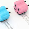 Two pink and blue roller stamps for math practice with numbered grids showing addition subtraction multiplication and divisio