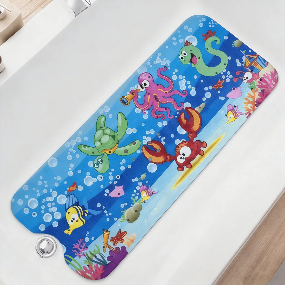 A blue cartoon bathtub mat featuring various colorful sea creatures and marine life.
