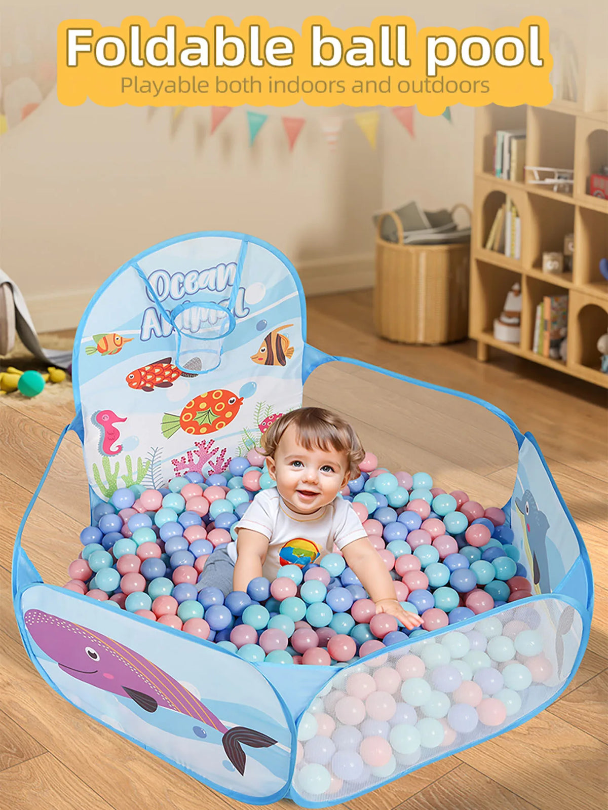 A colorful foldable ball pool with a sea animal theme, featuring a large playpen and a basketball hoop.