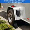 A silver trailer or vehicle is shown with a heavy-duty rubber wheel chock installed on the tire.
