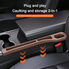 A brown car seat gap filler organizer with grooves is shown installed in a car seat interior.
