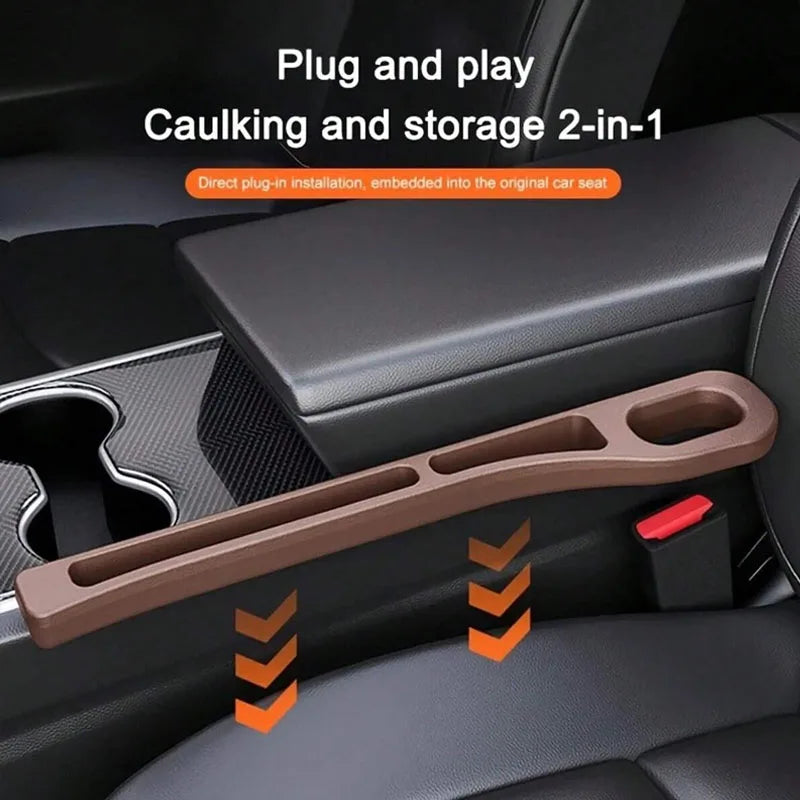 A brown car seat gap filler organizer with grooves is shown installed in a car seat interior.