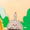 A compact cartoon broom and dustpan set with a cute animal design for tabletop cleaning.
