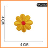 A yellow embroidered flower patch with a red center, measuring 4 cm across.