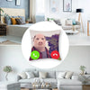 A novelty throw pillow cover shaped like a pig's face with a green phone icon on the cheek.