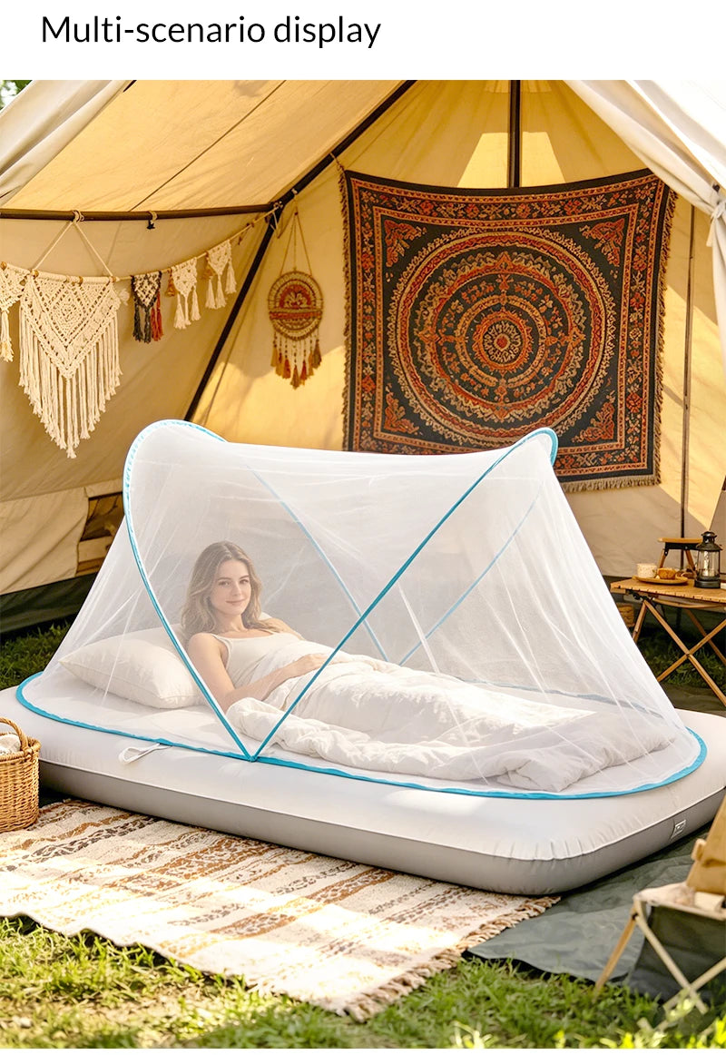 A white mosquito net is set up inside a tent, providing a protected sleeping area for camping or travel.