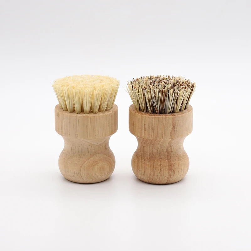 Two wooden dish scrub brushes made with natural sisal bristles are shown side by side.
