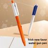 An orange and white pen is shown spraying water while writing on a light-colored surface.