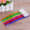 A set of six colorful hard bristled toothbrushes arranged in a row on a wooden surface.