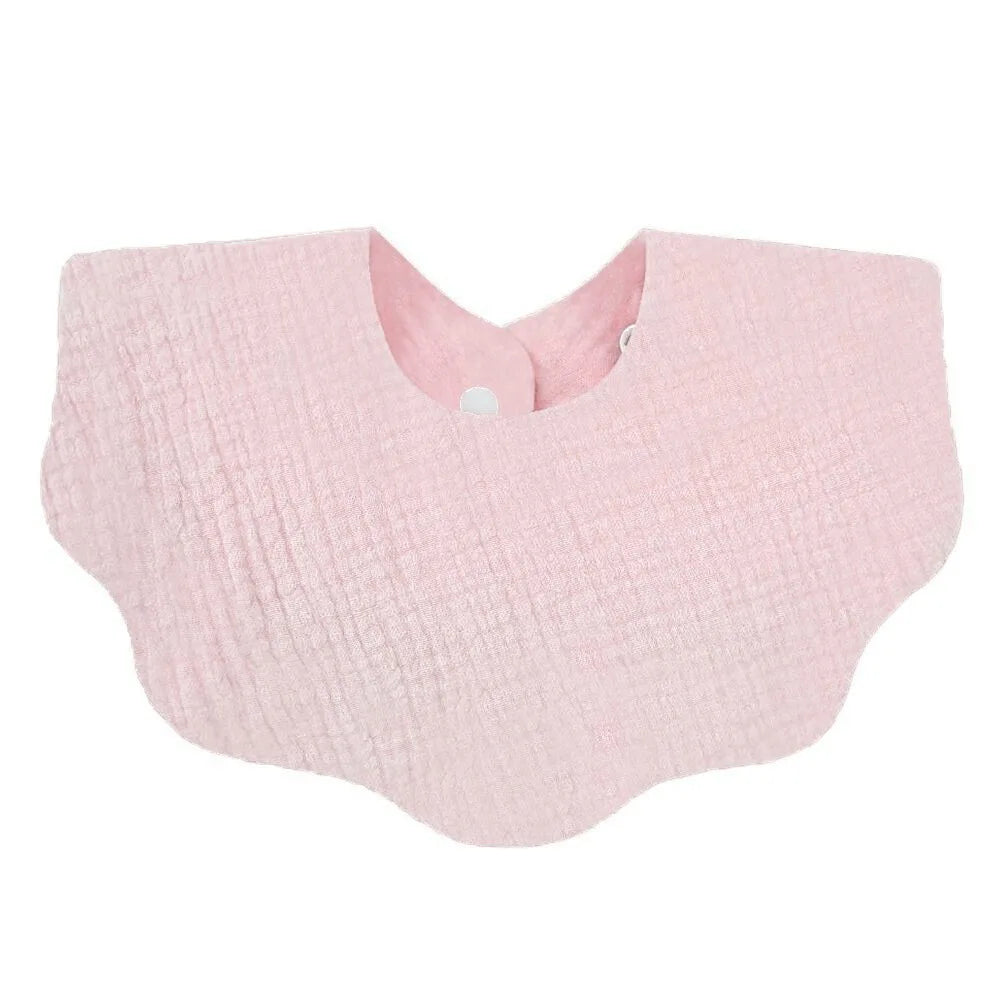 A light pink, textured cotton baby bib in a bandana style for newborns.