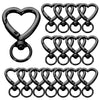A set of black heart-shaped spring hook keychains for keys, bags, and luggage.