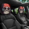 A pair of fun cartoon eye headrest covers featuring a bearded man wearing sunglasses and a red knit hat, placed in a car seat
