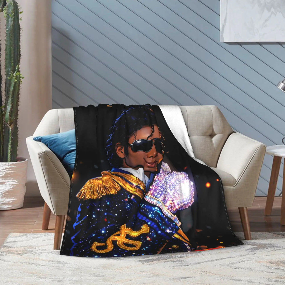 A black graphic throw blanket featuring a silhouette of Michael Jackson in a royal blue and gold outfit.