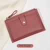 A pink purple women's slim PU leather card holder wallet with a stitched edge and leather strap.