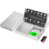 A silver digital pocket scale with a protective case and instruction manual is shown on a white background.