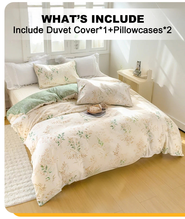 A set of elegant floral tea art print duvet cover and two pillowcases displayed on a bed.