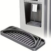 A silicone drip tray with raised ridges is shown in front of a refrigerator compartment.