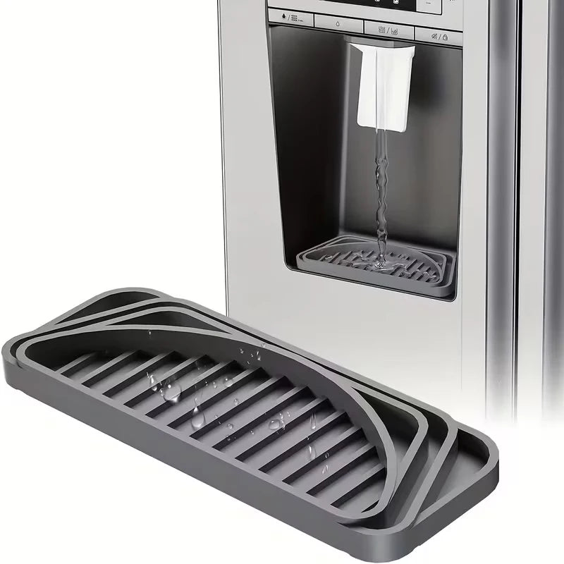 A silicone drip tray with raised ridges is shown in front of a refrigerator compartment.