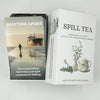 A box set of Spill Tea oracle cards featuring illustrations and keywords for truth-telling