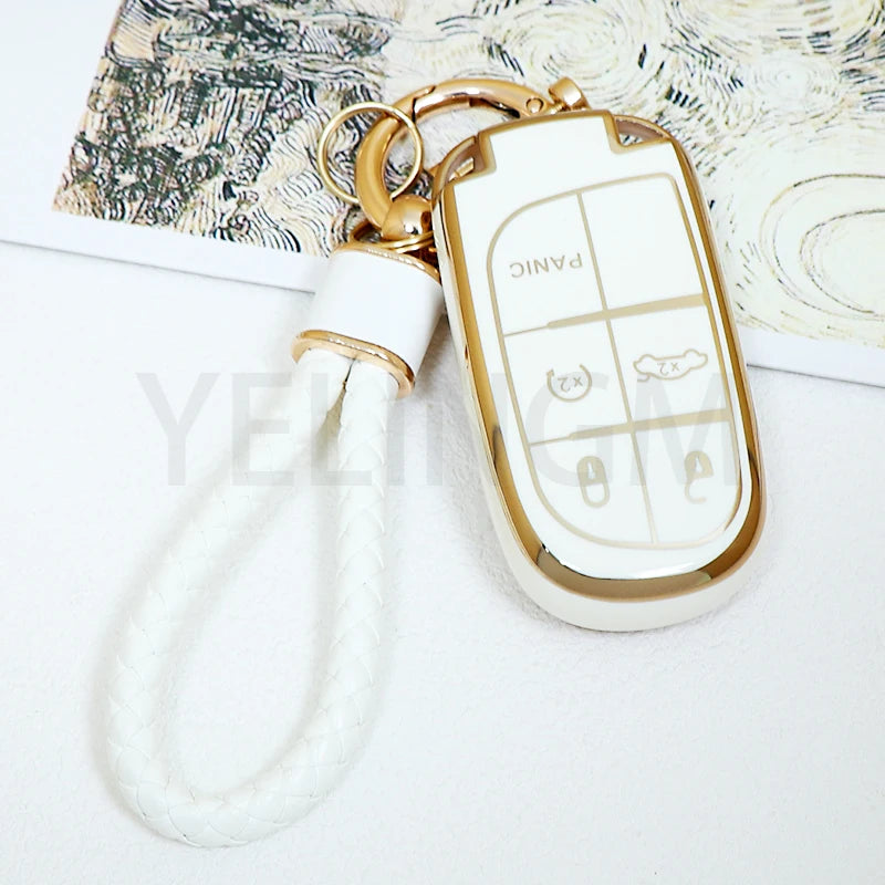 A white TPU car key fob cover with a gold chain attached to a white cord.