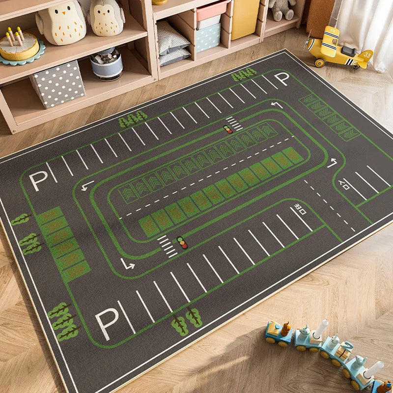 A green and gray play mat depicting a road with traffic markings for children's play.
