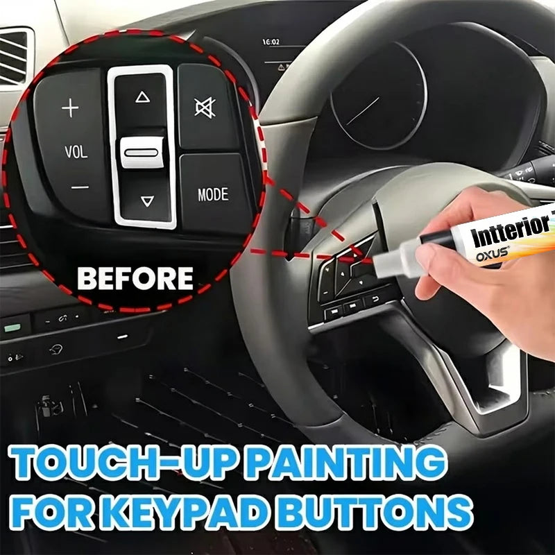 A hand uses an interior paint touch-up pen to repair keypad buttons on a car steering wheel.